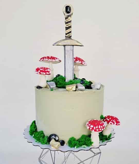 Торт Праздничный № 639, декор меч, грибы
